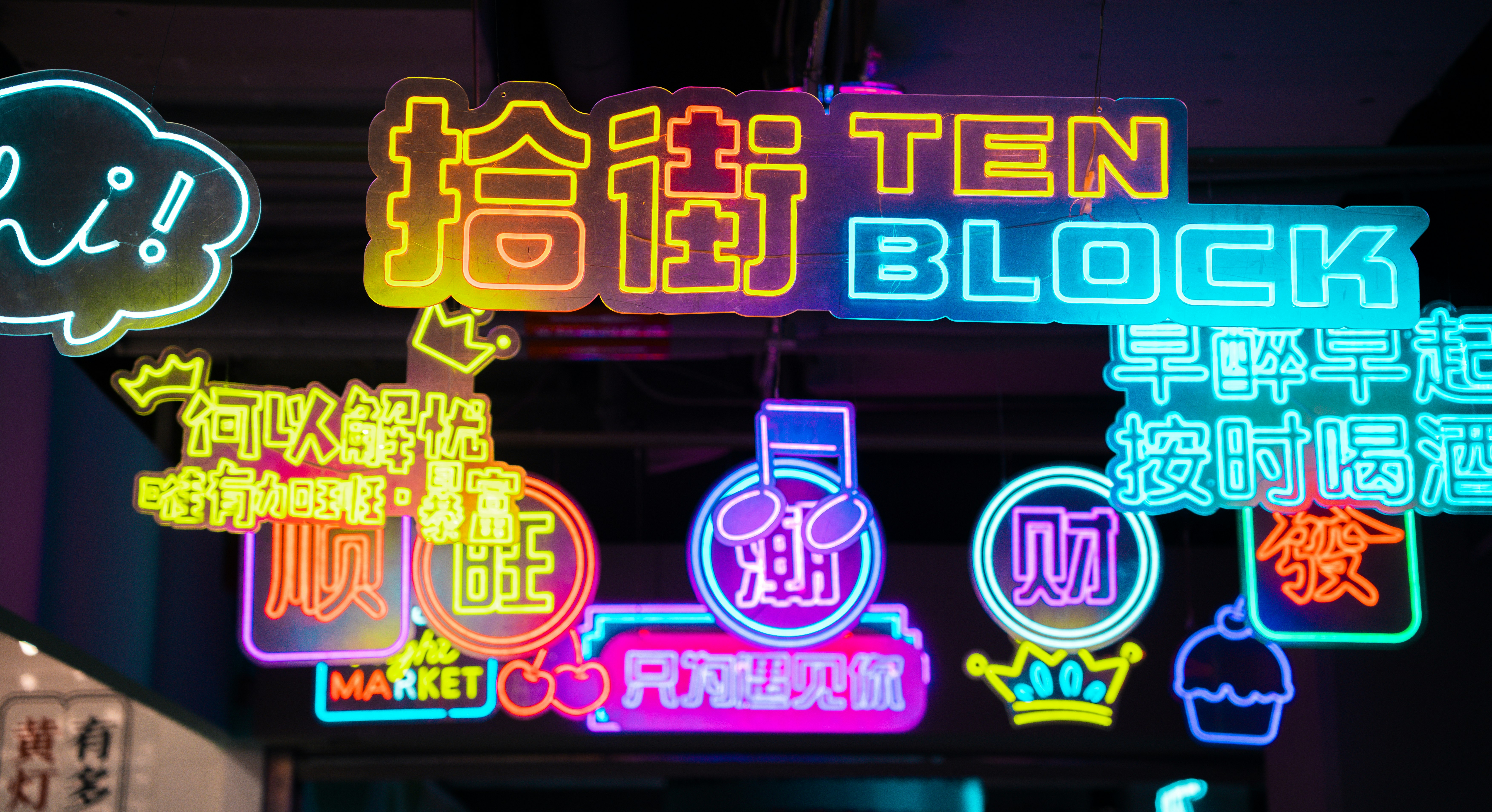 Colorful neon signs marketing street showcasing SEO content generation